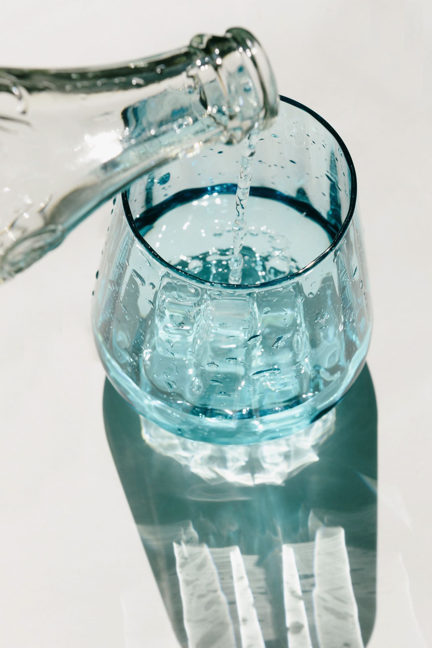 Crystal-clear water being poured into a glass